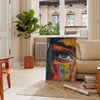 Abstract expressionism with dynamic green and orange splashes - in a Parisian living room with a sofa and a fig plant