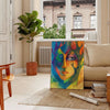 Abstract expressionism with green and blue hues, depicting creative energy - in a Parisian living room with a sofa and a fig plant