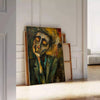 Abstract expressionism artwork with bold green and orange colors - leaning on a herringbone floor against a white panelled wall