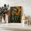 Abstract expressionism artwork with bold green and orange colors - styled on a counter with eucalyptus and a bowl of lemons