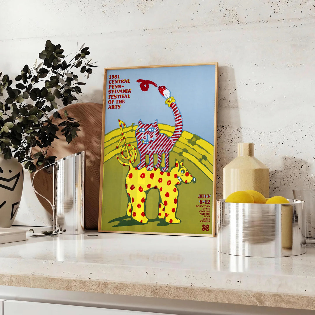 vintage poster featuring a colorful Festival of Arts design with green and blue hues - styled on a counter with eucalyptus and a bowl of lemons