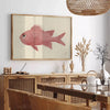 A colorful fish illustration with orange and gray tones on a textured background - in a Parisian living room with a sofa and a fig plant