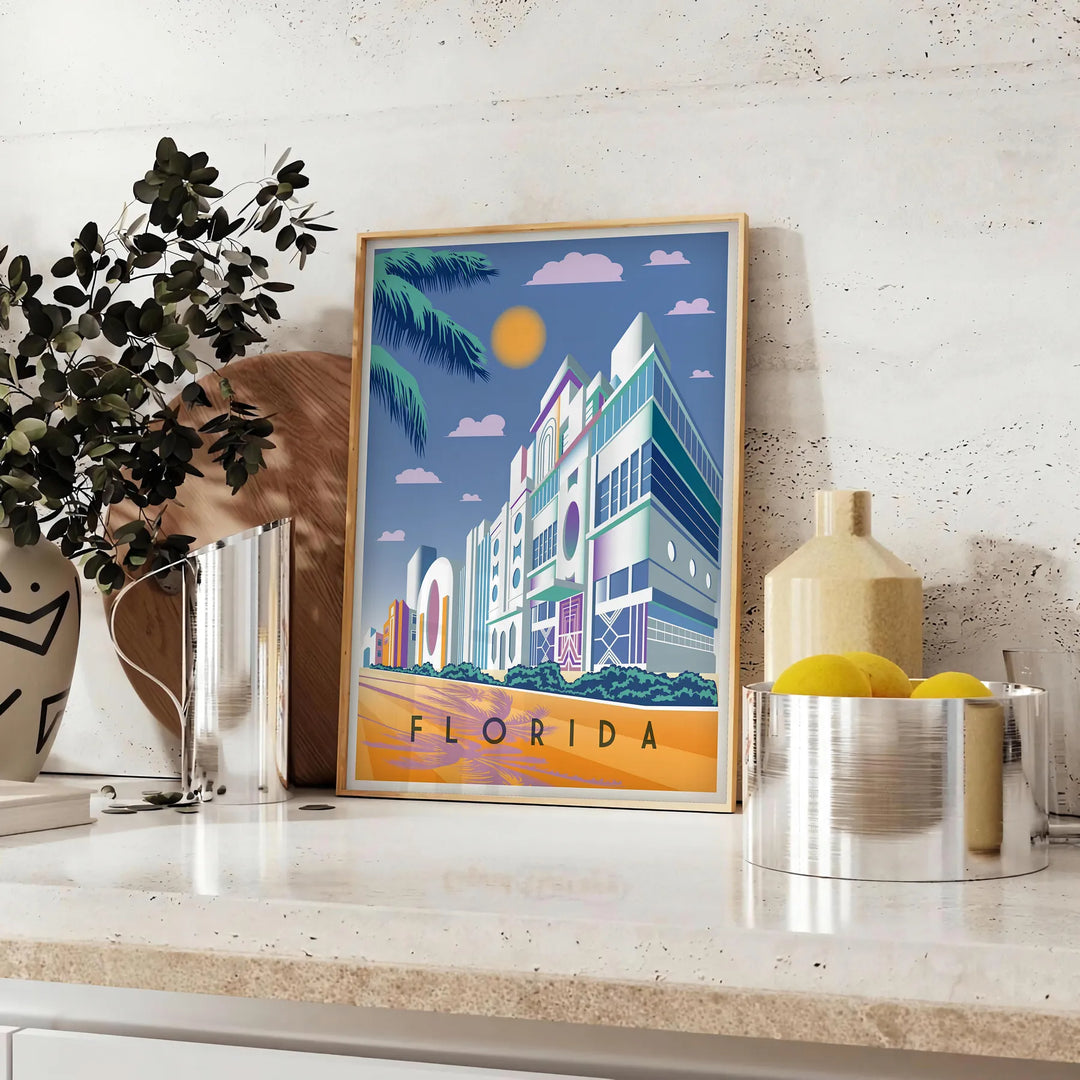 Vintage travel poster of Florida featuring warm orange and brown tones - styled on a counter with eucalyptus and a bowl of lemons