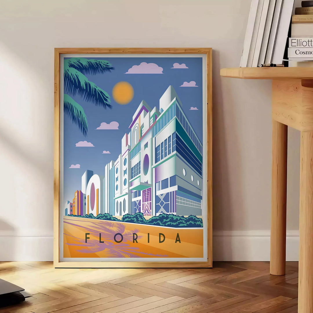 Vintage travel poster of Florida featuring warm orange and brown tones - beside a round wooden side table with books