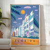 Vintage travel poster of Florida featuring warm orange and brown tones - in a bright minimalist room with a plant and an armchair