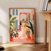 Design floral vintage com flores laranja e cinza em um fundo texturizado - ao lado de uma mesa de apoio redonda em madeira com livros