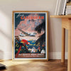 Colorful travel poster featuring a tropical Caribbean landscape with palm trees and a sunset. - beside a round wooden side table with books