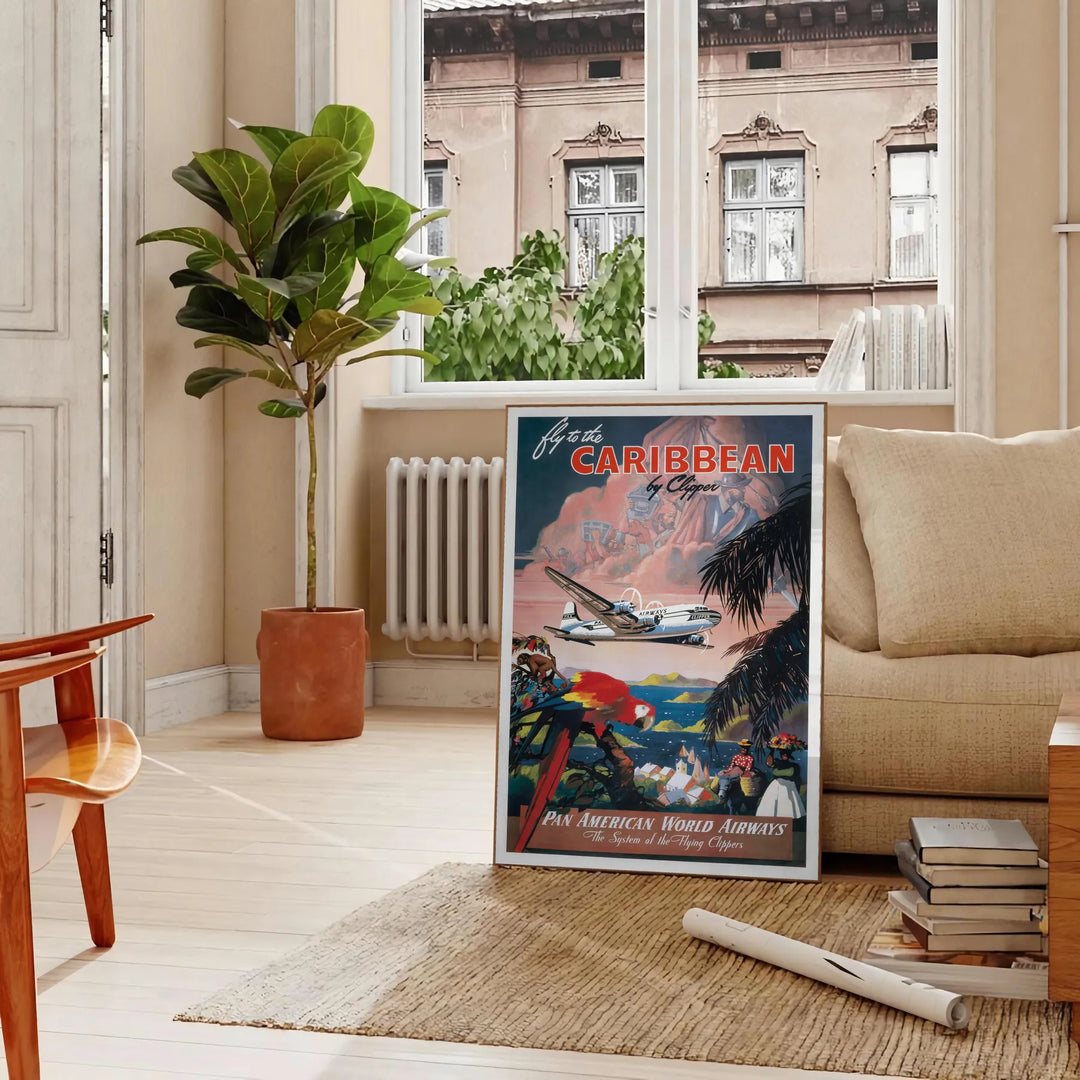 Colorful travel poster featuring a tropical Caribbean landscape with palm trees and a sunset. - in a Parisian living room with a sofa and a fig plant