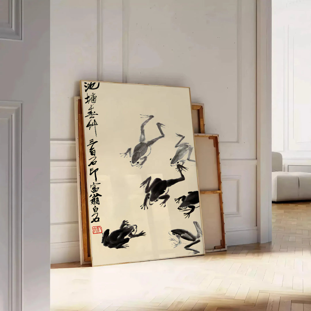 A stylized frog illustration in black and orange, inspired by Matsumoto Hoji, Japan - leaning on a herringbone floor against a white panelled wall