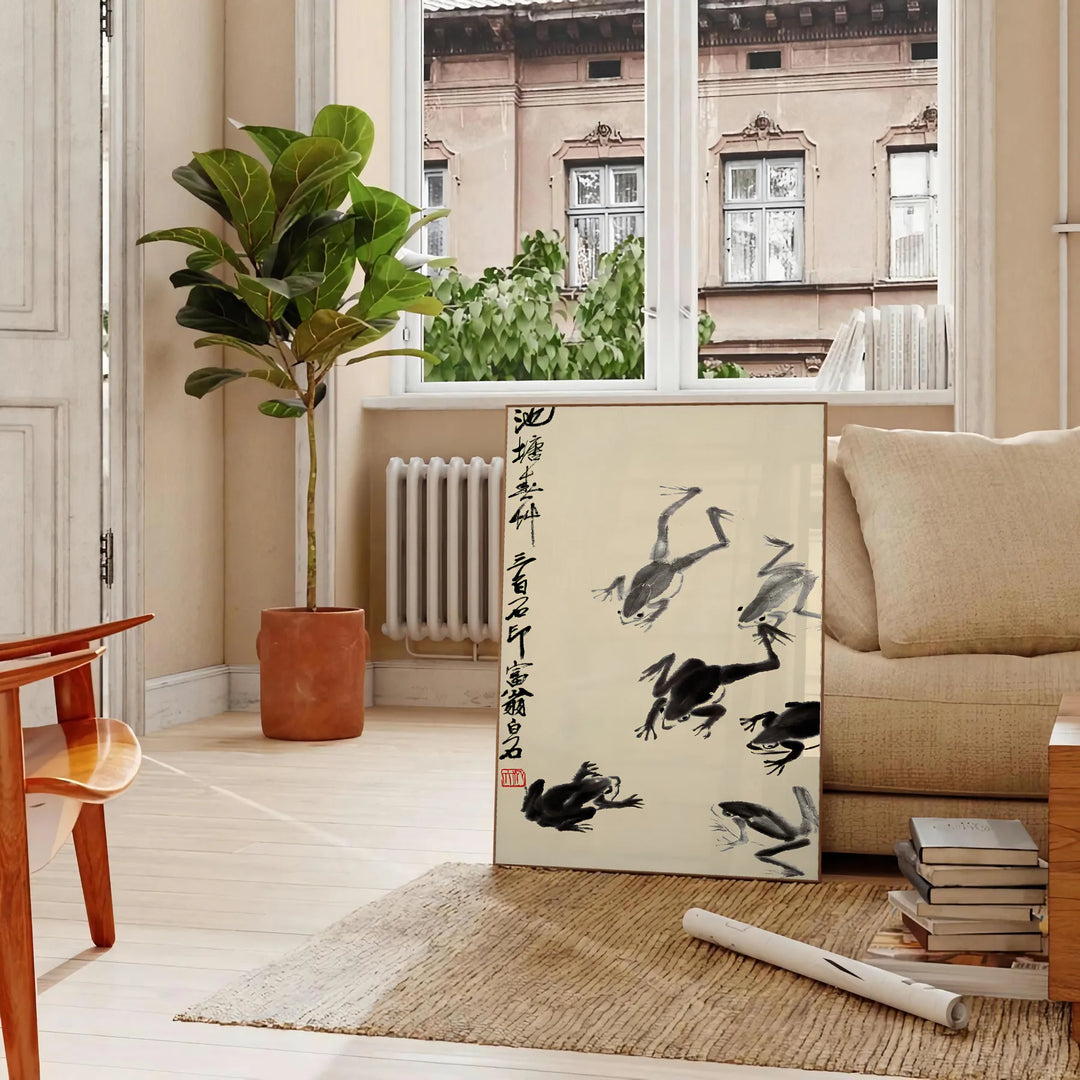 A stylized frog illustration in black and orange, inspired by Matsumoto Hoji, Japan - in a Parisian living room with a sofa and a fig plant