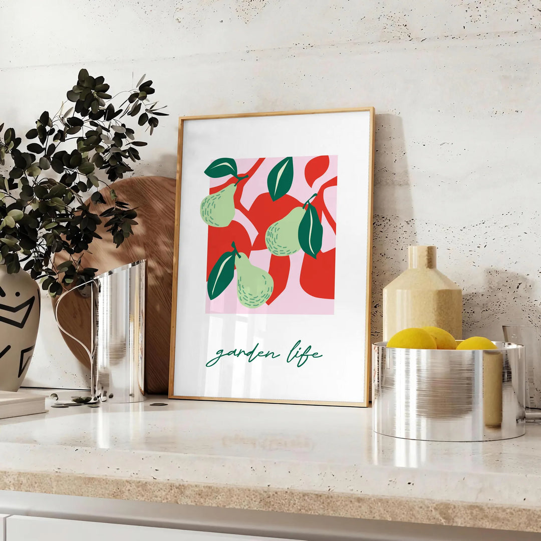 Abstract composition of fruits in green and red hues - styled on a counter with eucalyptus and a bowl of lemons