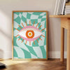 Abstract design with swirling green and orange shapes resembling a playful cosmic scene - beside a round wooden side table with books