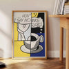 A playful illustration of coffee cups in black and green hues - beside a round wooden side table with books