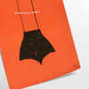 A playful design featuring abstract shapes in black and orange - as a rolled, unframed print