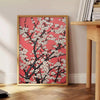 floral garden scene with black and orange tones - beside a round wooden side table with books