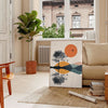 Geometric shapes in green and orange on a minimalist background - in a Parisian living room with a sofa and a fig plant