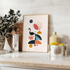 Geometric shapes in black and orange on a minimal background - styled on a counter with eucalyptus and a bowl of lemons
