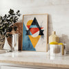 Geometric shapes in orange and blue on a minimal background - styled on a counter with eucalyptus and a bowl of lemons