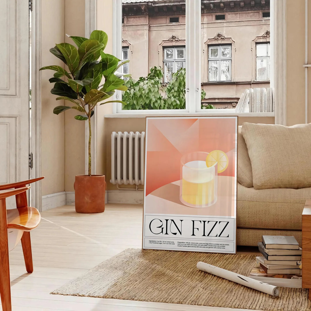 Abstract splash of orange and black depicting a Gin Fizz cocktail - in a Parisian living room with a sofa and a fig plant