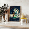 Art Deco poster featuring a golf silhouette under a large moon - styled on a counter with eucalyptus and a bowl of lemons