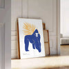 A detailed illustration of a gorilla surrounded by green and blue foliage - leaning on a herringbone floor against a white panelled wall