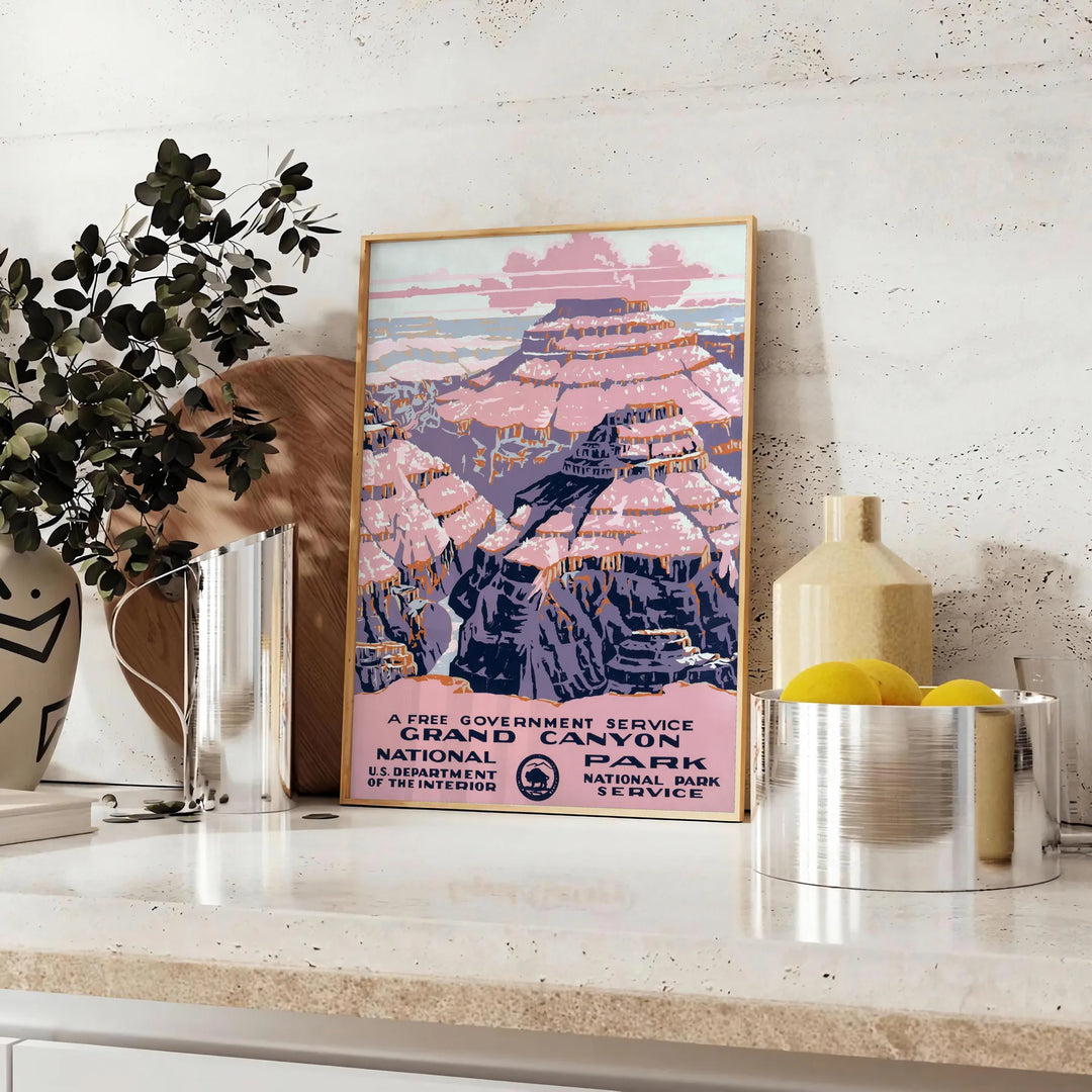 Illustration of the Grand Canyon with warm earthy tones and dramatic rock formations - styled on a counter with eucalyptus and a bowl of lemons