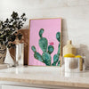 Abstract graphic art featuring dynamic shades of gray and orange - styled on a counter with eucalyptus and a bowl of lemons