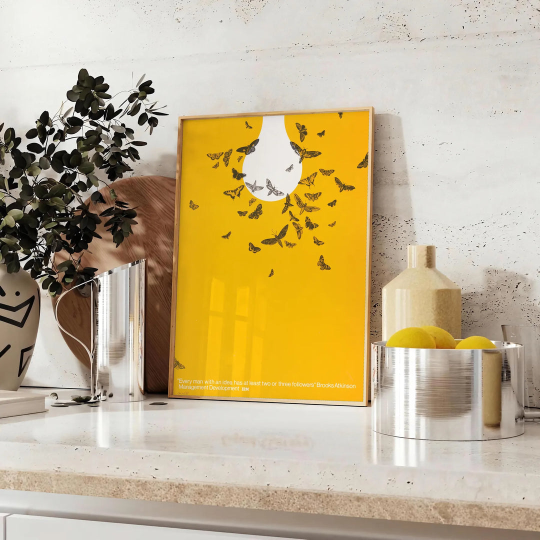 Abstract graphic design featuring orange and white space elements - styled on a counter with eucalyptus and a bowl of lemons