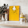 Abstract graphic design featuring orange and white space elements - styled on a counter with eucalyptus and a bowl of lemons