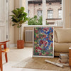 Abstract design with gray and orange shapes on a textured background - in a Parisian living room with a sofa and a fig plant
