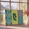 Abstract graphic design in shades of green and gray - beside a round wooden side table with books
