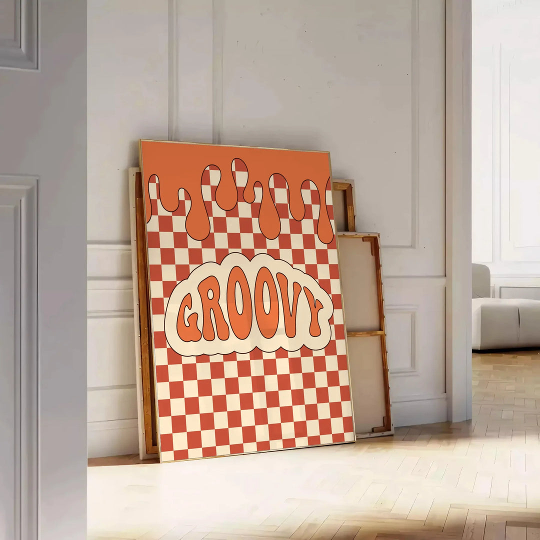 Retro-style poster featuring abstract shapes in orange and brown tones - leaning on a herringbone floor against a white panelled wall