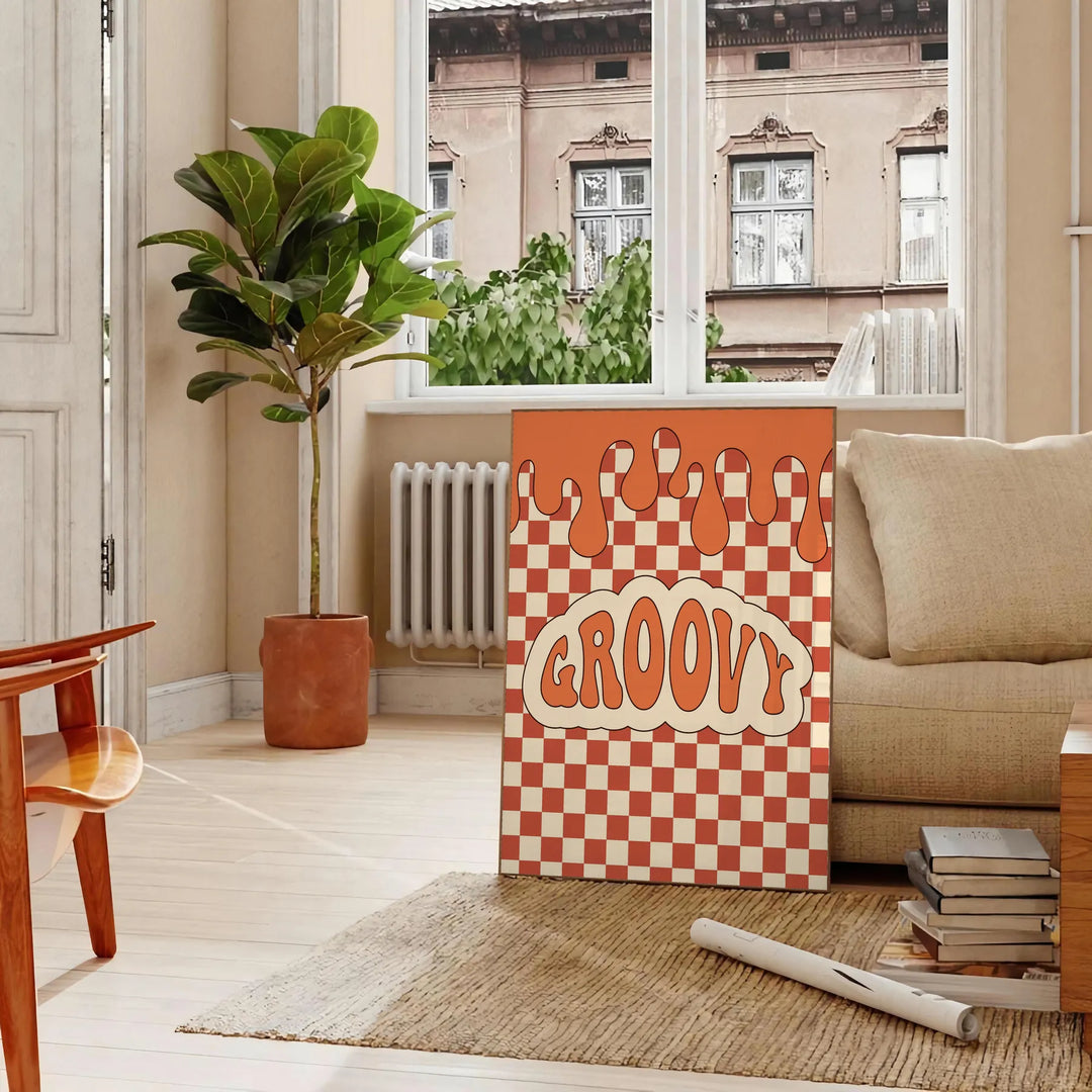 Retro-style poster featuring abstract shapes in orange and brown tones - in a Parisian living room with a sofa and a fig plant