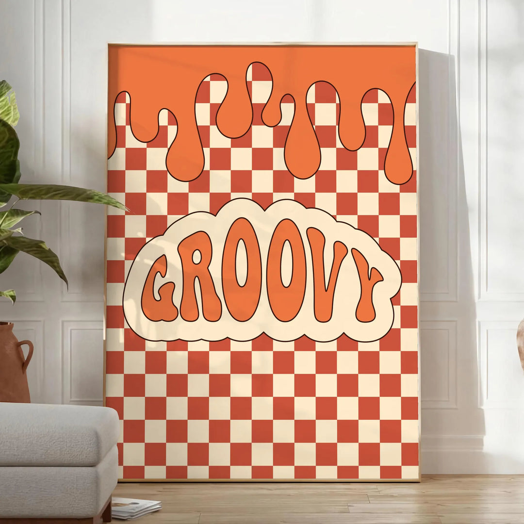 Retro-style poster featuring abstract shapes in orange and brown tones - in a bright minimalist room with a plant and an armchair
