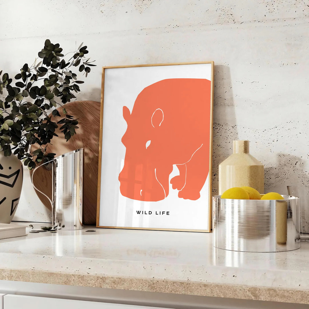 A black and orange hippopotamus in a natural setting, wildlife art - styled on a counter with eucalyptus and a bowl of lemons
