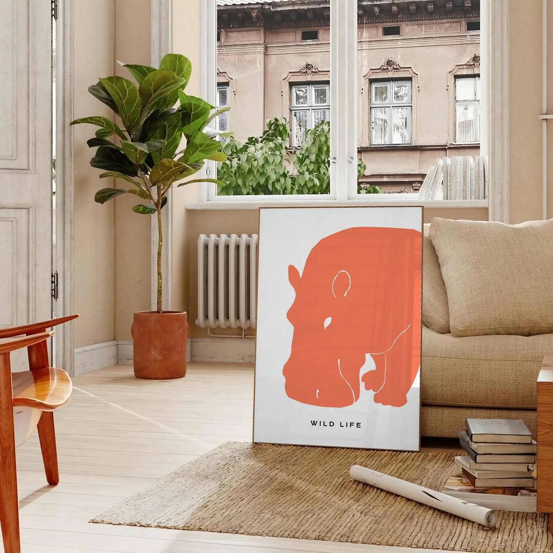 A black and orange hippopotamus in a natural setting, wildlife art - in a Parisian living room with a sofa and a fig plant