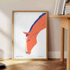 Un cheval galopant à travers un paysage cosmique avec des nuances orange et bleu - à côté d'une table d'appoint ronde en bois avec des livres