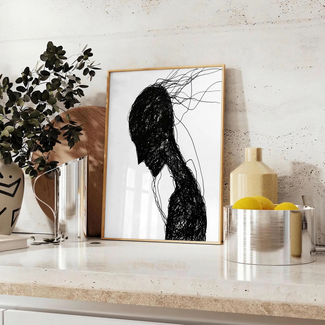Abstract human figure in bohemian style with gray and black tones - styled on a counter with eucalyptus and a bowl of lemons