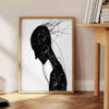 Abstract human figure in bohemian style with gray and black tones - beside a round wooden side table with books