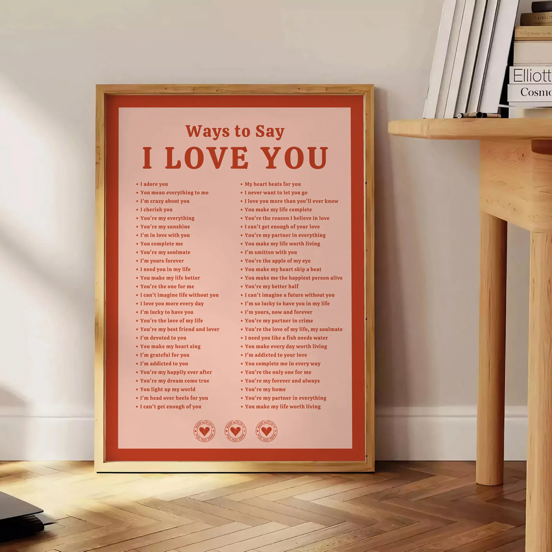 Abstract design featuring the phrase 'I Love You' in soft gray and brown tones - beside a round wooden side table with books