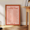 Abstract design featuring the phrase 'I Love You' in soft gray and brown tones - beside a round wooden side table with books