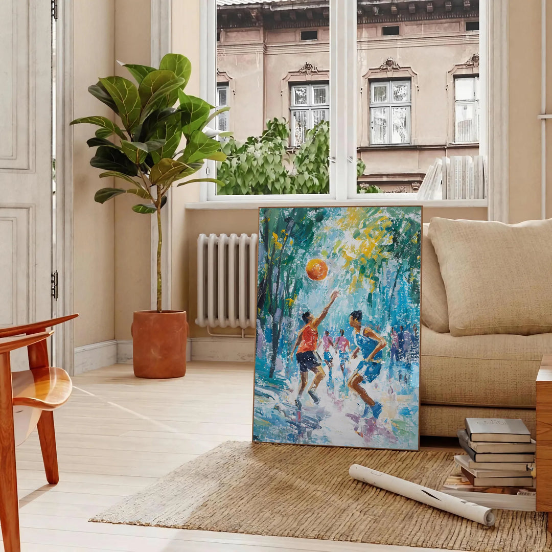 Impressionist landscape with lush greens and blues - in a Parisian living room with a sofa and a fig plant