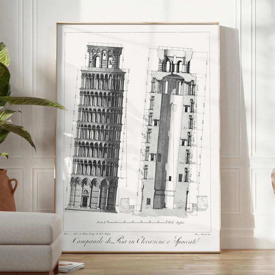 Travel poster featuring the Leaning Tower of Pisa in gray and white tones - in a bright minimalist room with a plant and an armchair