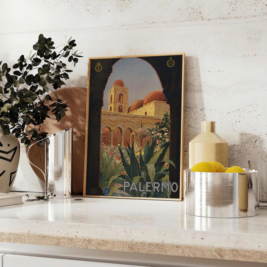 Illustration of Italy's landscapes with green hills and gray skies - styled on a counter with eucalyptus and a bowl of lemons