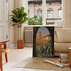Illustration of Italy's landscapes with green hills and gray skies - in a Parisian living room with a sofa and a fig plant