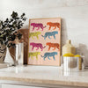 A jaguar illustrated in bold orange and gray tones against a textured background - styled on a counter with eucalyptus and a bowl of lemons