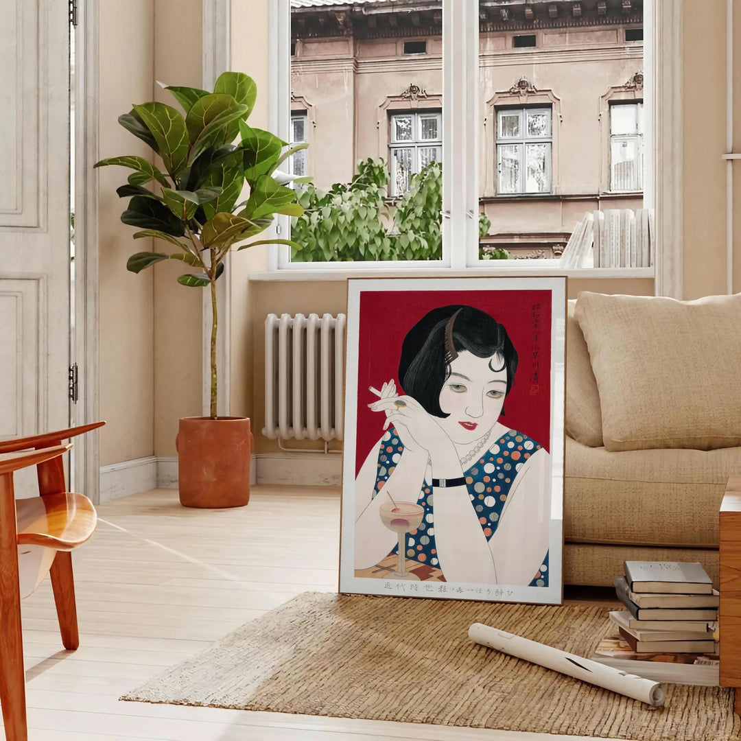 Abstract representation of Japan with black and orange hues - in a Parisian living room with a sofa and a fig plant