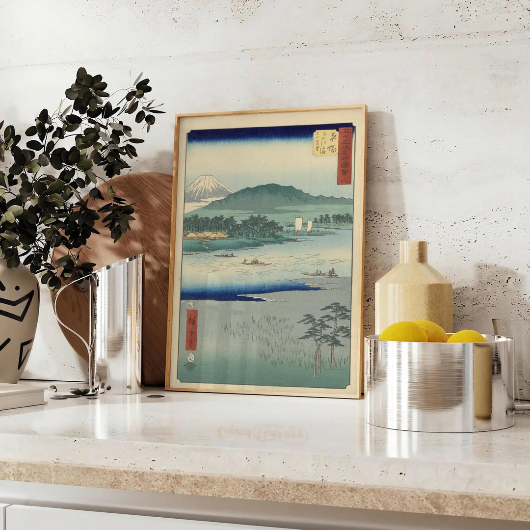A serene landscape featuring lush green hills and a blue sky in Japan - styled on a counter with eucalyptus and a bowl of lemons