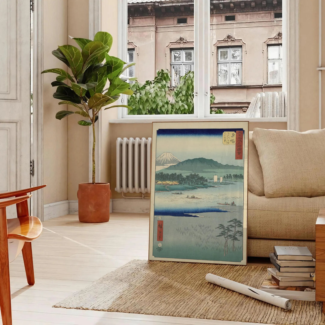 A serene landscape featuring lush green hills and a blue sky in Japan - in a Parisian living room with a sofa and a fig plant