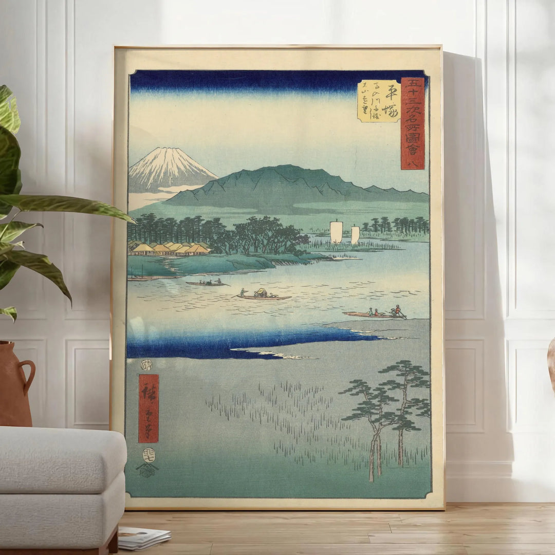A serene landscape featuring lush green hills and a blue sky in Japan - in a bright minimalist room with a plant and an armchair